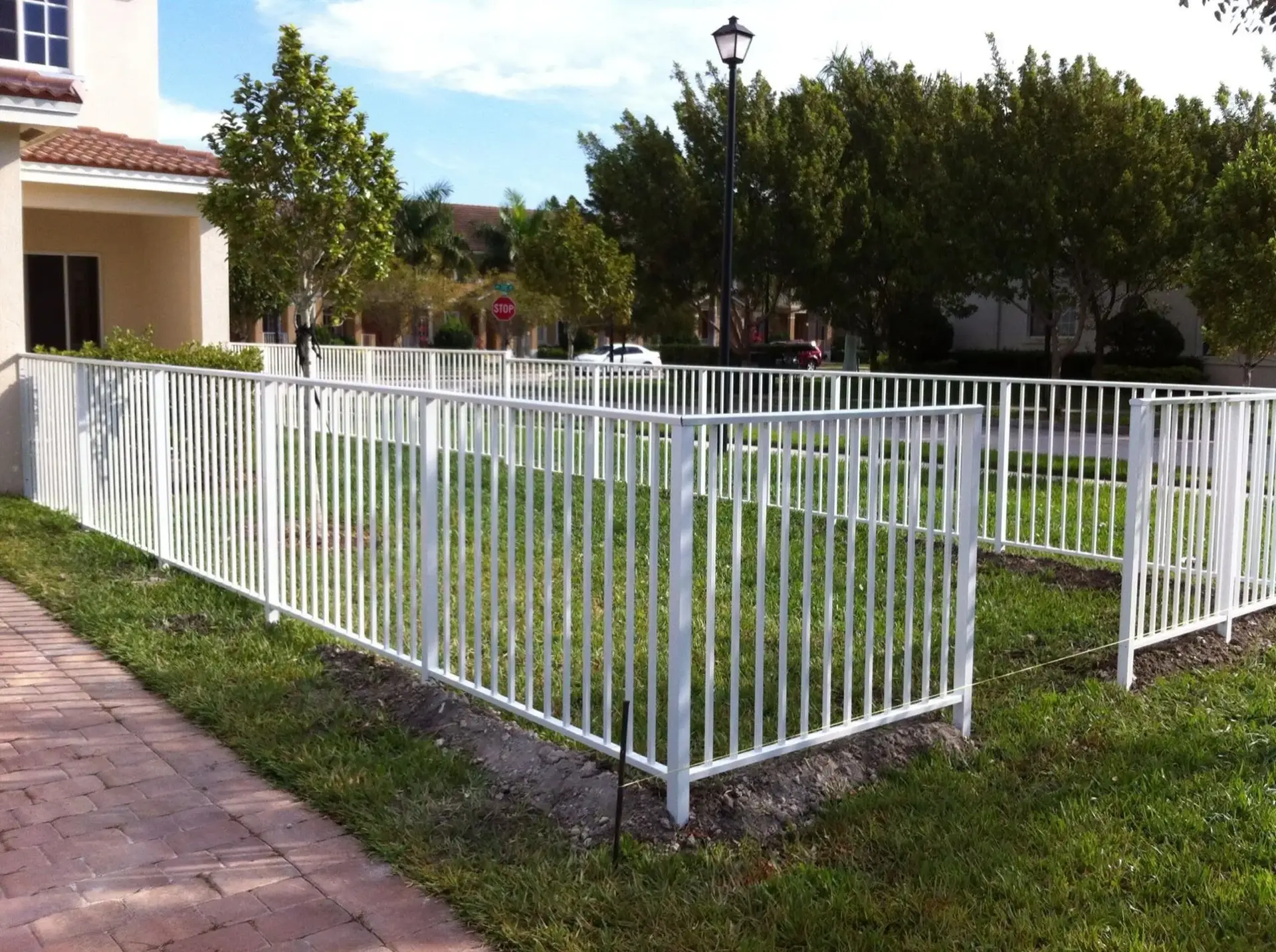 White aluminum picket fence installed in Miami, FL