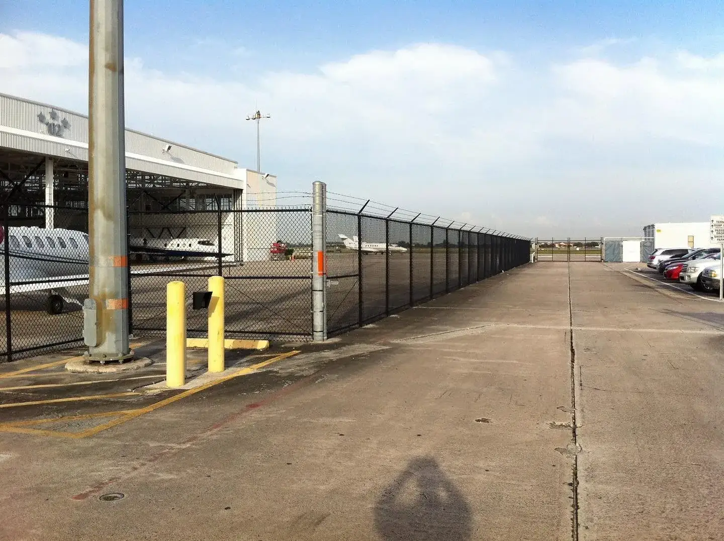 Commercial chain link fence at a Miami airport hangar