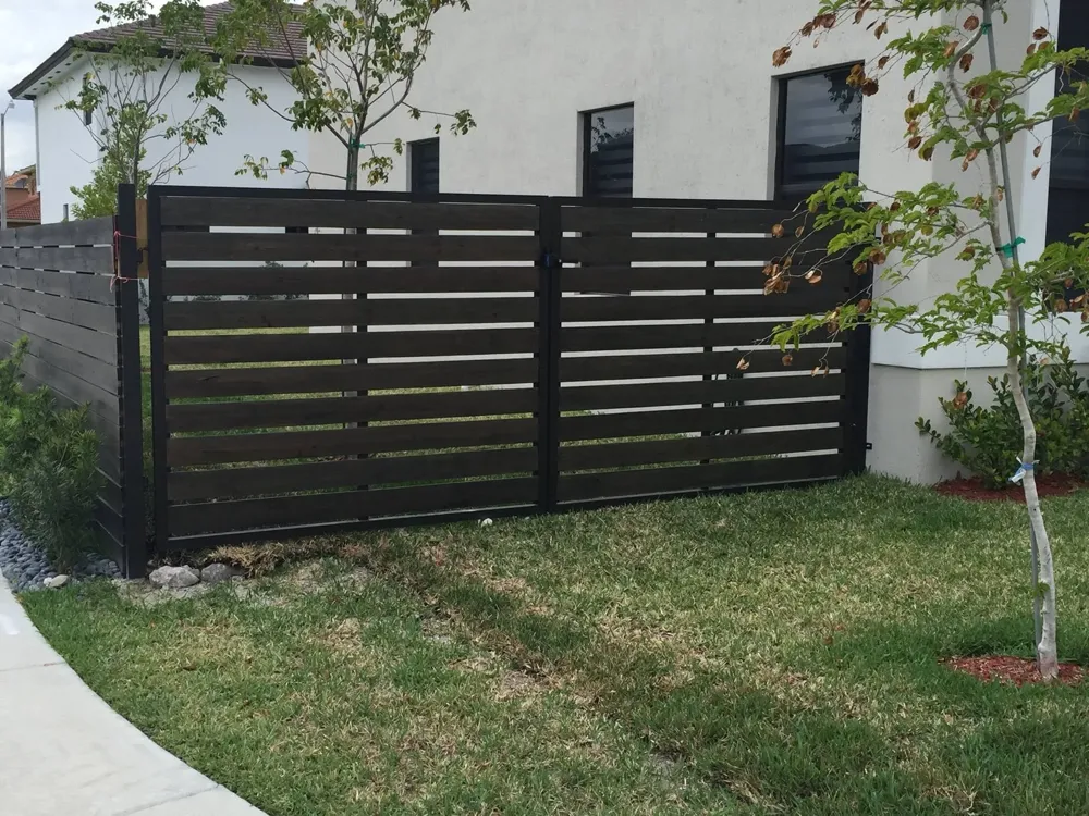 Modern horizontal wood slat gate installed in Miami
