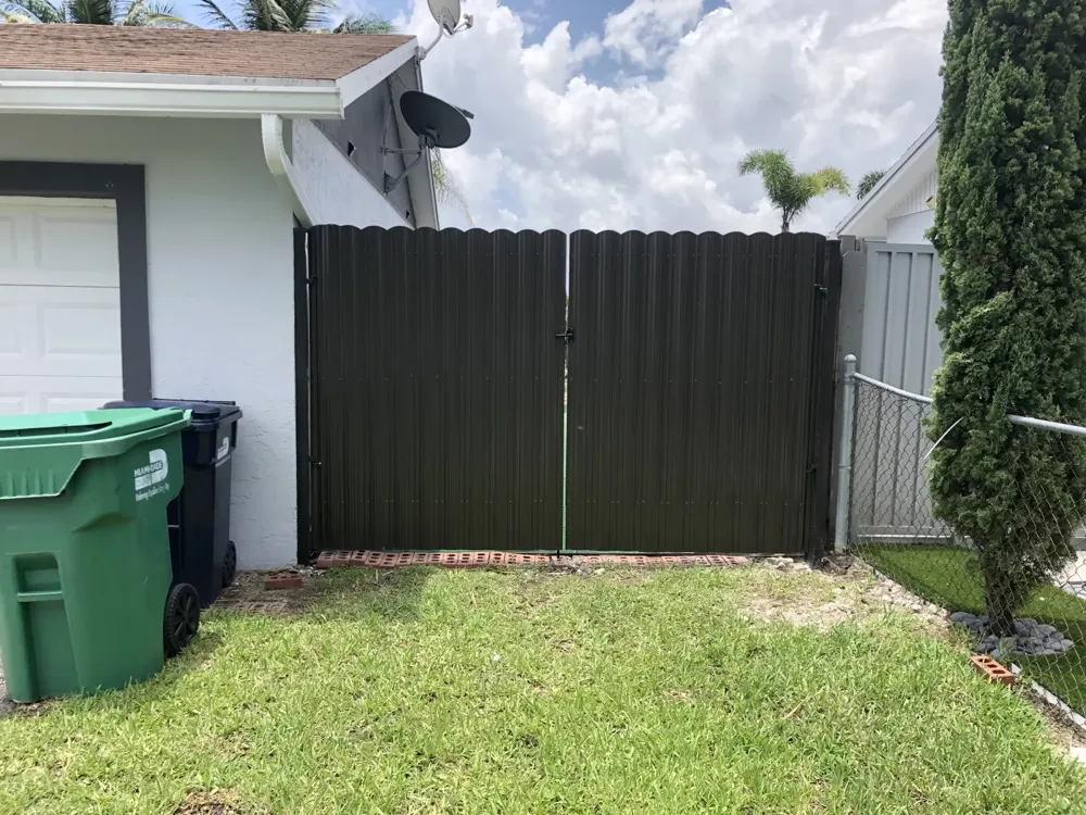 Dark charcoal Dura Fence double gate installed in Miami