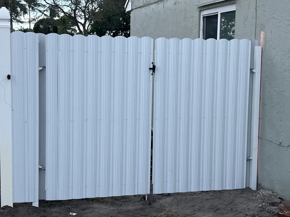 White Dura Fence metal double gate installed in Miami